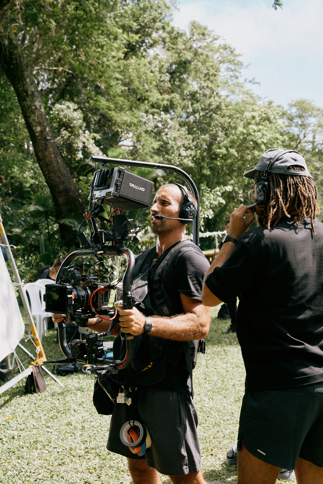 Camera operator with a gimbal rig on an outdoor set